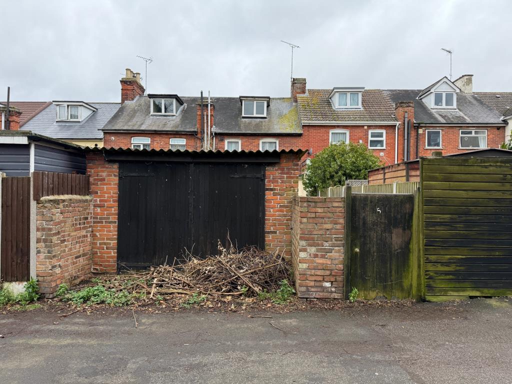 Lot: 111 - ESTABLISHED FOUR-BEDROOM TERRACE HOUSE FOR IMPROVEMENT - Garage in need of repair accessed from the rear